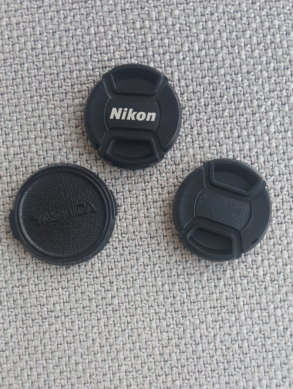 3 Lens caps.Nikon,Yashica.52mm